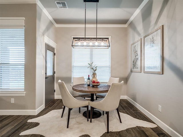 11716 SW 47th St, Mustang, OK 73064 - dining space featuring ornamental molding and wood finished floors