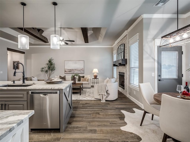 11716 SW 47th St, Mustang, OK 73064 - kitchen featuring dishwasher, ceiling fan, open floor plan, dark wood finished floors, and light stone countertops