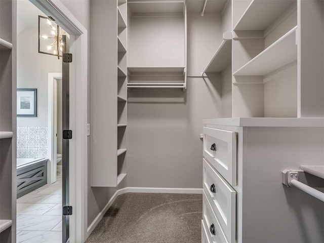 11716 SW 47th St, Mustang, OK 73064 - walk in closet featuring light marble finish flooring