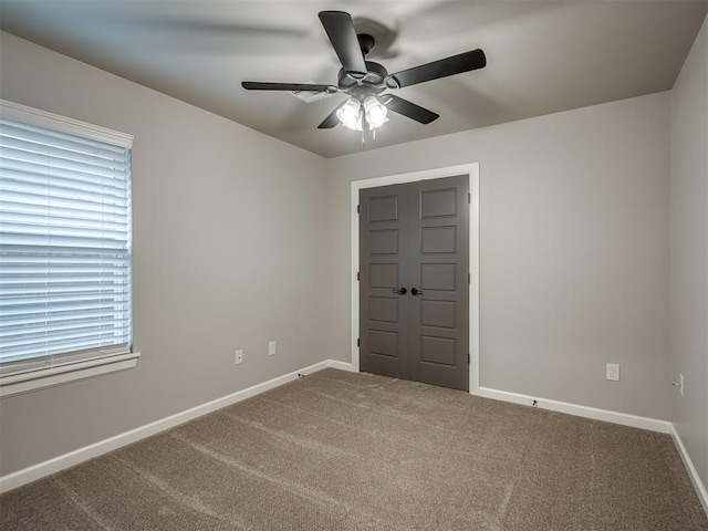 11716 SW 47th St, Mustang, OK 73064 - carpeted empty room featuring a ceiling fan and baseboards