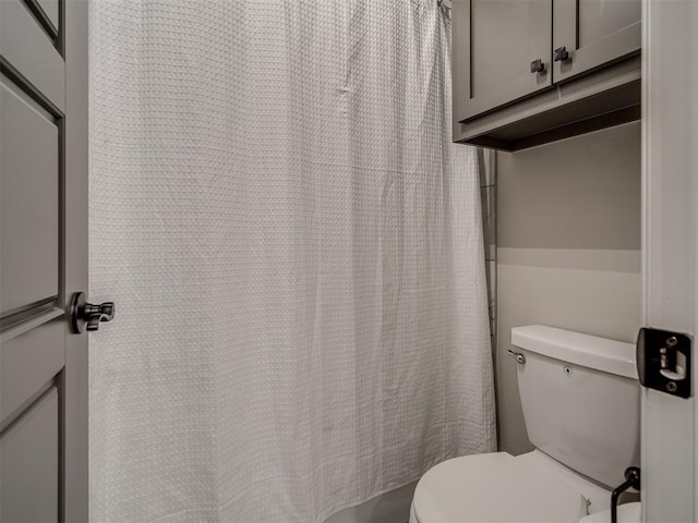 11716 SW 47th St, Mustang, OK 73064 - bathroom featuring toilet and a shower with shower curtain