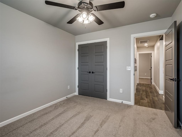 11716 SW 47th St, Mustang, OK 73064 - unfurnished bedroom with carpet, ceiling fan, and a closet