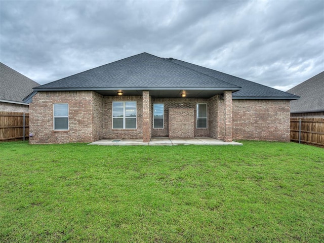 11716 SW 47th St, Mustang, OK 73064 - rear view of property with a fenced backyard, brick siding, a patio, and a shingled roof