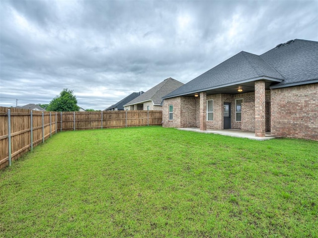11716 SW 47th St, Mustang, OK 73064 - fenced backyard with a patio