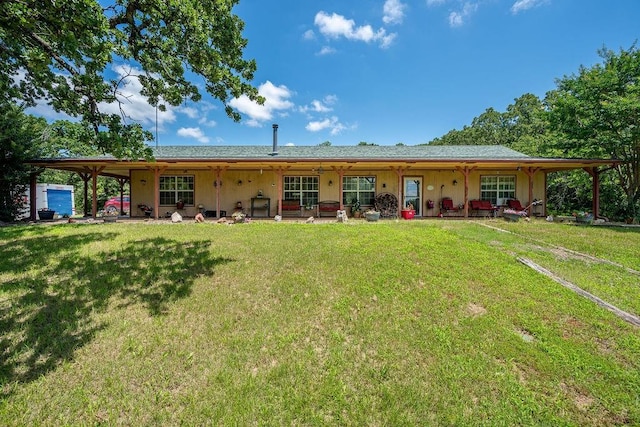 12333 E Tecumseh Rd, Norman, OK 73026 - back of house featuring a lawn
