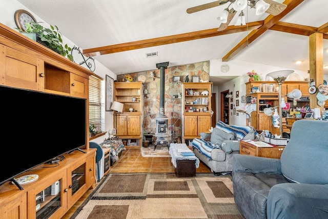 12333 E Tecumseh Rd, Norman, OK 73026 - living area featuring a wood stove and a ceiling fan