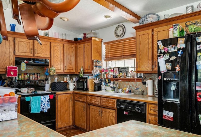12333 E Tecumseh Rd, Norman, OK 73026 - kitchen with black appliances, backsplash, light countertops, beam ceiling, and under cabinet range hood