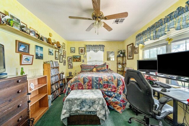 12333 E Tecumseh Rd, Norman, OK 73026 - carpeted bedroom featuring an office area and ceiling fan
