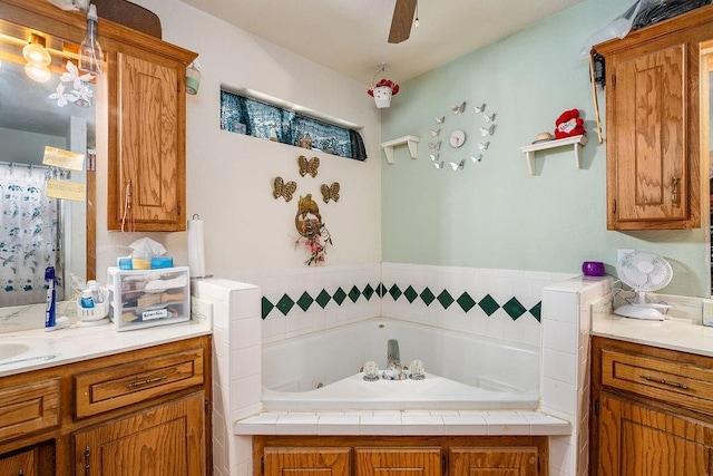 12333 E Tecumseh Rd, Norman, OK 73026 - bathroom featuring a whirlpool tub, vanity, and ceiling fan