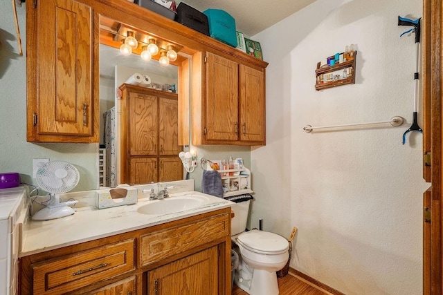 12333 E Tecumseh Rd, Norman, OK 73026 - full bath featuring vanity and wood finished floors