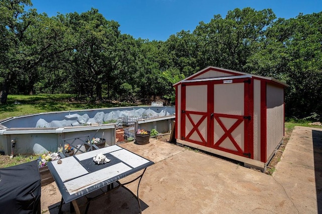 12333 E Tecumseh Rd, Norman, OK 73026 - view of shed with outdoor dining area