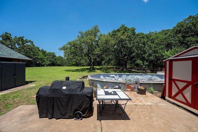 12333 E Tecumseh Rd, Norman, OK 73026 - view of patio / terrace featuring a storage shed, a grill, and outdoor dining area