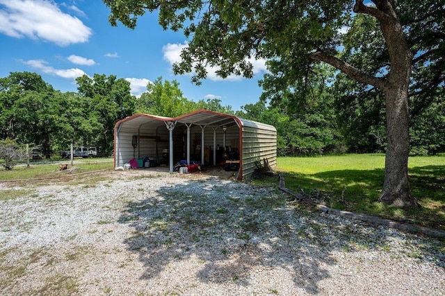 12333 E Tecumseh Rd, Norman, OK 73026 - garage featuring a carport