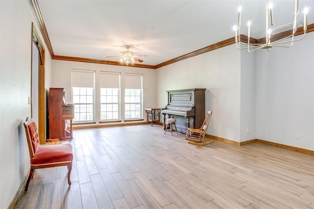 11748 SW 54th St, Mustang, OK 73064 - sitting room featuring ornamental molding, wood finished floors, ceiling fan, and a chandelier