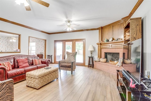 11748 SW 54th St, Mustang, OK 73064 - living room featuring ceiling fan, light wood-style floors, crown molding, and a brick fireplace