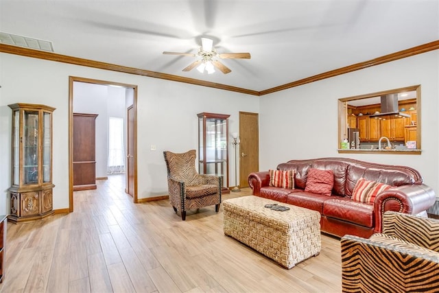 11748 SW 54th St, Mustang, OK 73064 - living area featuring a ceiling fan, light wood-style flooring, and ornamental molding
