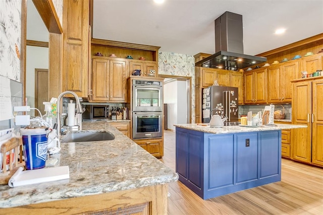 11748 SW 54th St, Mustang, OK 73064 - kitchen with island range hood, appliances with stainless steel finishes, a center island with sink, light wood-style floors, and light stone countertops