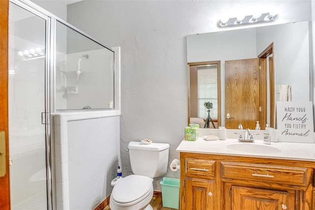 11748 SW 54th St, Mustang, OK 73064 - full bathroom with vanity, a shower stall, and a textured wall