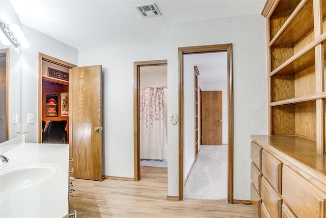 11748 SW 54th St, Mustang, OK 73064 - full bath featuring wood finished floors and vanity
