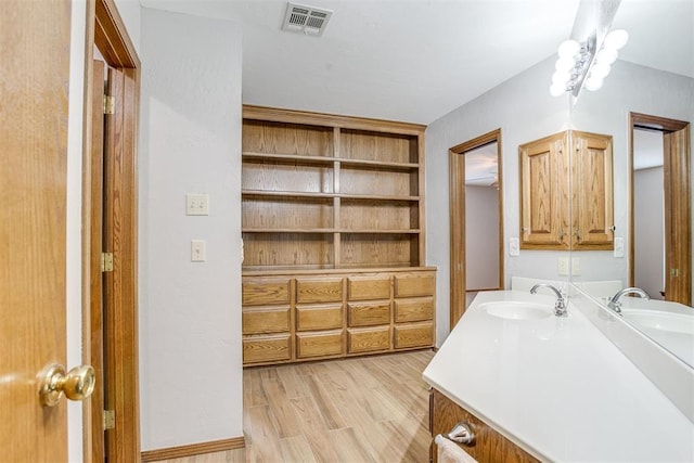 11748 SW 54th St, Mustang, OK 73064 - bathroom featuring vanity and wood finished floors