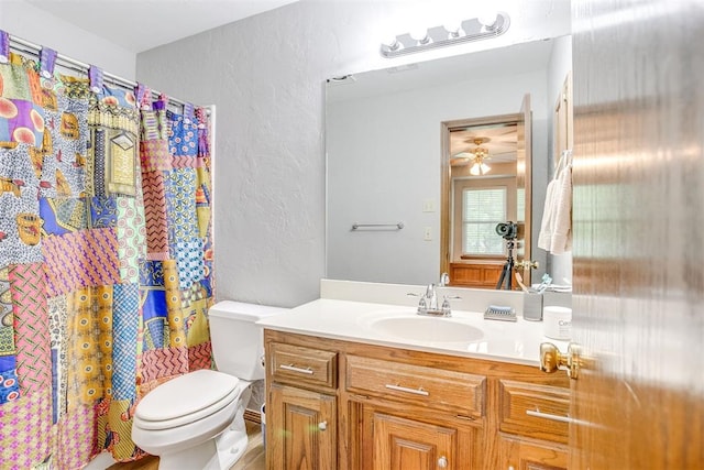 11748 SW 54th St, Mustang, OK 73064 - bathroom with vanity, a textured wall, a shower with shower curtain, and a ceiling fan