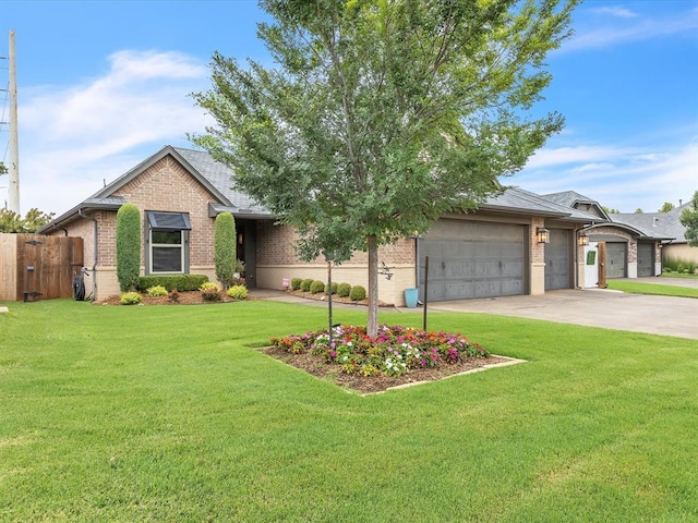 16117 Cale Dr, Edmond, OK 73013 - view of front facade featuring brick siding, a garage, and driveway