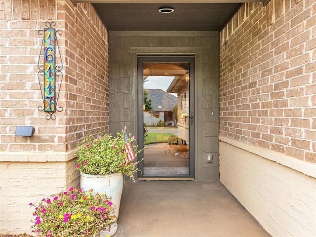 16117 Cale Dr, Edmond, OK 73013 - view of exterior entry with brick siding