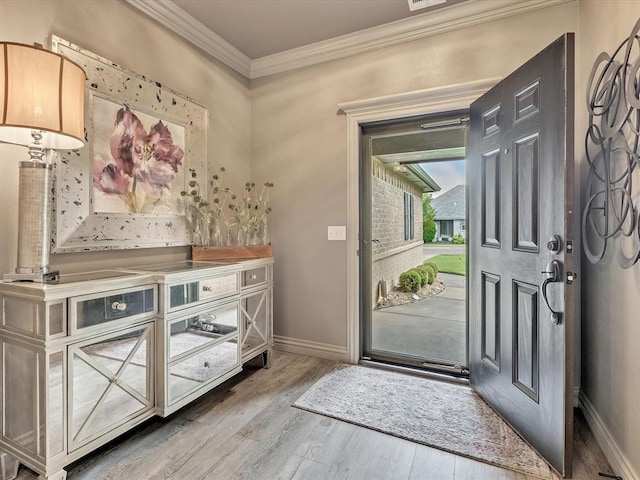 16117 Cale Dr, Edmond, OK 73013 - entryway with crown molding and wood finished floors
