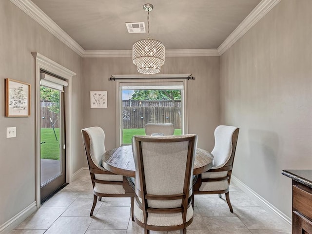 16117 Cale Dr, Edmond, OK 73013 - dining area featuring ornamental molding and light tile patterned flooring
