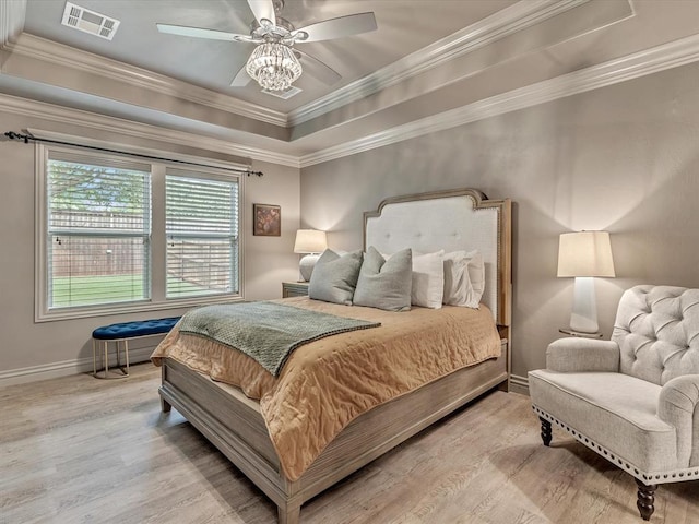 16117 Cale Dr, Edmond, OK 73013 - bedroom with wood finished floors, ornamental molding, a raised ceiling, and ceiling fan