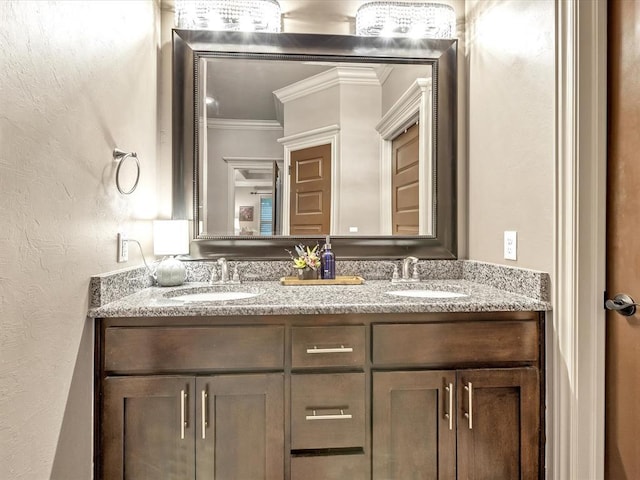 16117 Cale Dr, Edmond, OK 73013 - bathroom with crown molding, double vanity, and a textured wall