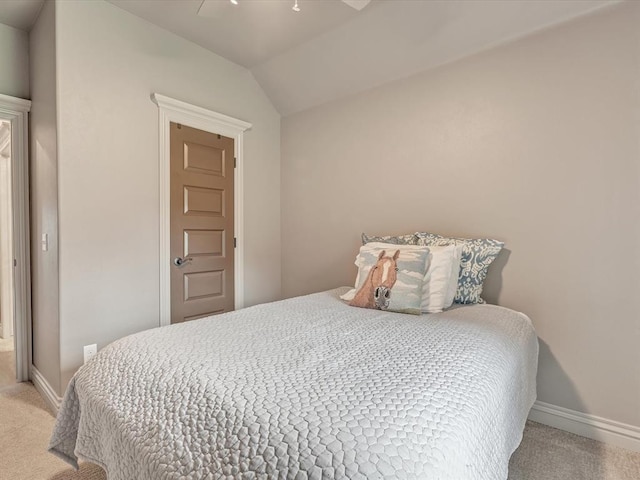 16117 Cale Dr, Edmond, OK 73013 - carpeted bedroom with vaulted ceiling and ceiling fan