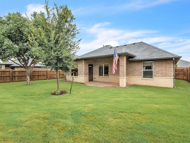16117 Cale Dr, Edmond, OK 73013 - rear view of property featuring brick siding, a patio, a fenced backyard, and a shingled roof