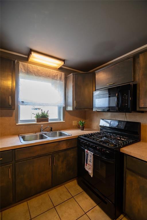 4117 NW 21st St, Oklahoma City, OK 73107 - kitchen with black appliances, light countertops, and dark brown cabinetry