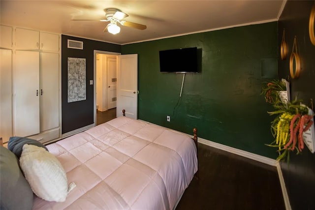 4117 NW 21st St, Oklahoma City, OK 73107 - bedroom featuring wood finished floors, ceiling fan, crown molding, and a closet