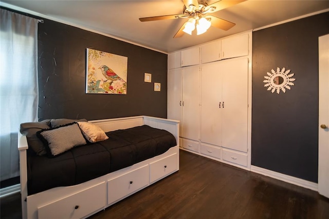 4117 NW 21st St, Oklahoma City, OK 73107 - bedroom with dark wood-type flooring, ceiling fan, and a closet