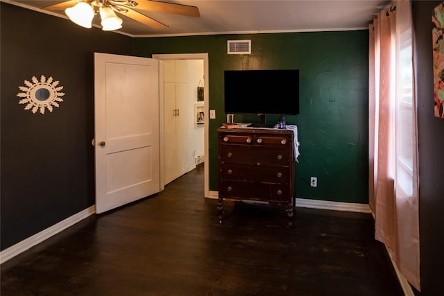 4117 NW 21st St, Oklahoma City, OK 73107 - bedroom with dark wood-type flooring, ornamental molding, and ceiling fan