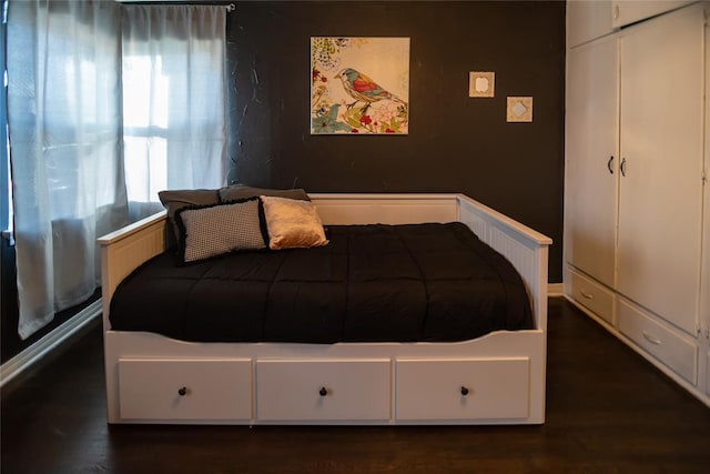 4117 NW 21st St, Oklahoma City, OK 73107 - bedroom featuring dark wood-type flooring