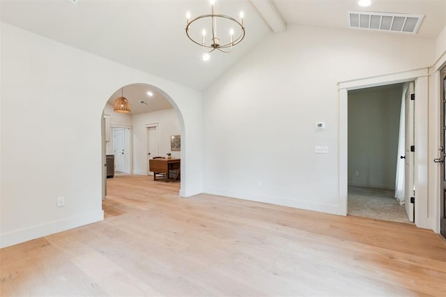 406 E Logan Ave, Guthrie, OK 73044 - unfurnished room featuring beamed ceiling, arched walkways, light wood-type flooring, a chandelier, and high vaulted ceiling