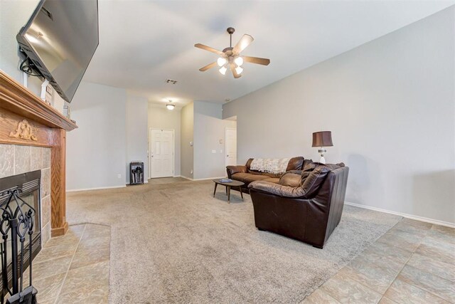 21854 Meadow Mist Cir, Edmond, OK 73012 - living room featuring ceiling fan and a tiled fireplace
