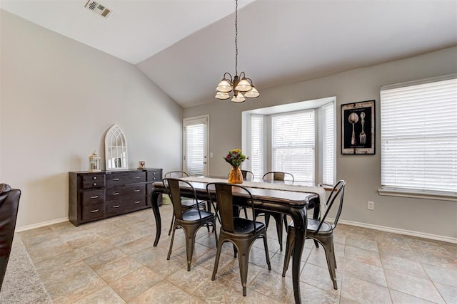 21854 Meadow Mist Cir, Edmond, OK 73012 - dining room featuring a chandelier, healthy amount of natural light, vaulted ceiling, and light tile patterned floors