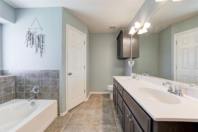 21854 Meadow Mist Cir, Edmond, OK 73012 - bathroom with double vanity and a garden tub