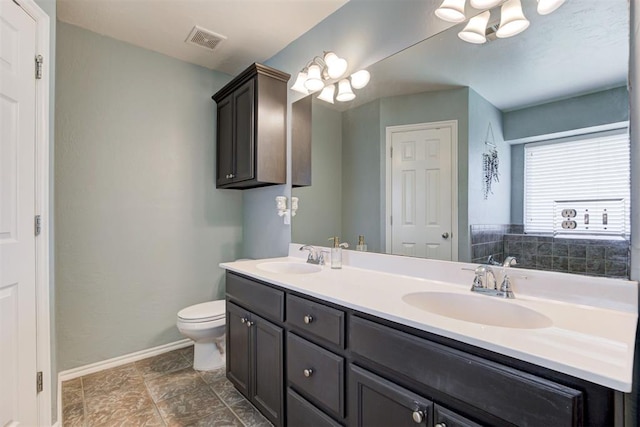 21854 Meadow Mist Cir, Edmond, OK 73012 - bathroom with double vanity and toilet