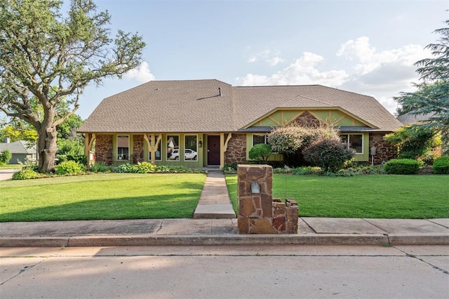 3425 Cheyenne Dr, Edmond, OK 73013 - view of front facade featuring stone siding and a front yard