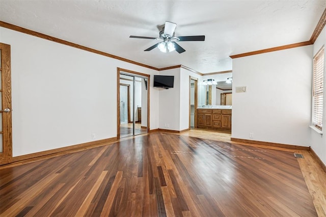 3425 Cheyenne Dr, Edmond, OK 73013 - unfurnished living room featuring wood finished floors, a ceiling fan, and ornamental molding