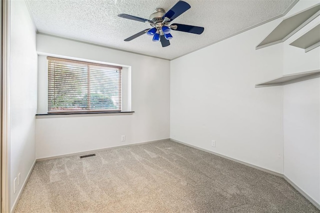 3425 Cheyenne Dr, Edmond, OK 73013 - spare room featuring carpet floors, ceiling fan, and a textured ceiling
