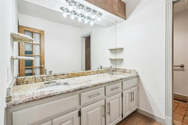 3425 Cheyenne Dr, Edmond, OK 73013 - full bathroom featuring double vanity and baseboards