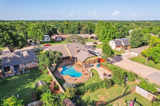 3425 Cheyenne Dr, Edmond, OK 73013 - drone / aerial view of a pool area and a heavily wooded area