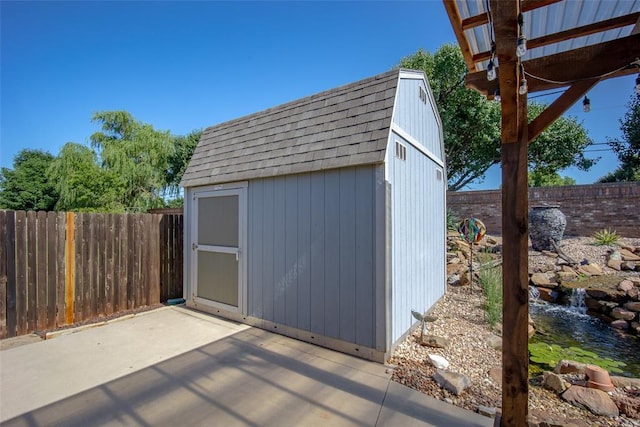 9124 SW 28th St, Oklahoma City, OK 73128 - view of shed with a fenced backyard