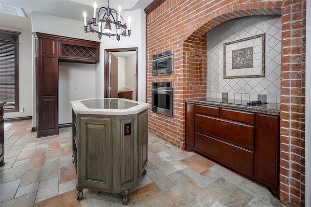 9124 SW 28th St, Oklahoma City, OK 73128 - kitchen featuring oven, stone tile floors, a chandelier, and electric cooktop